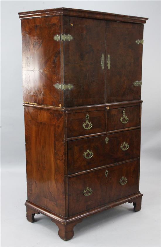 An early 18th century crossbanded cabinet on chest, W.3ft D.1ft 9in. H.5ft 6in.